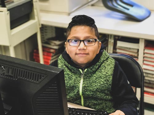 student at his computer